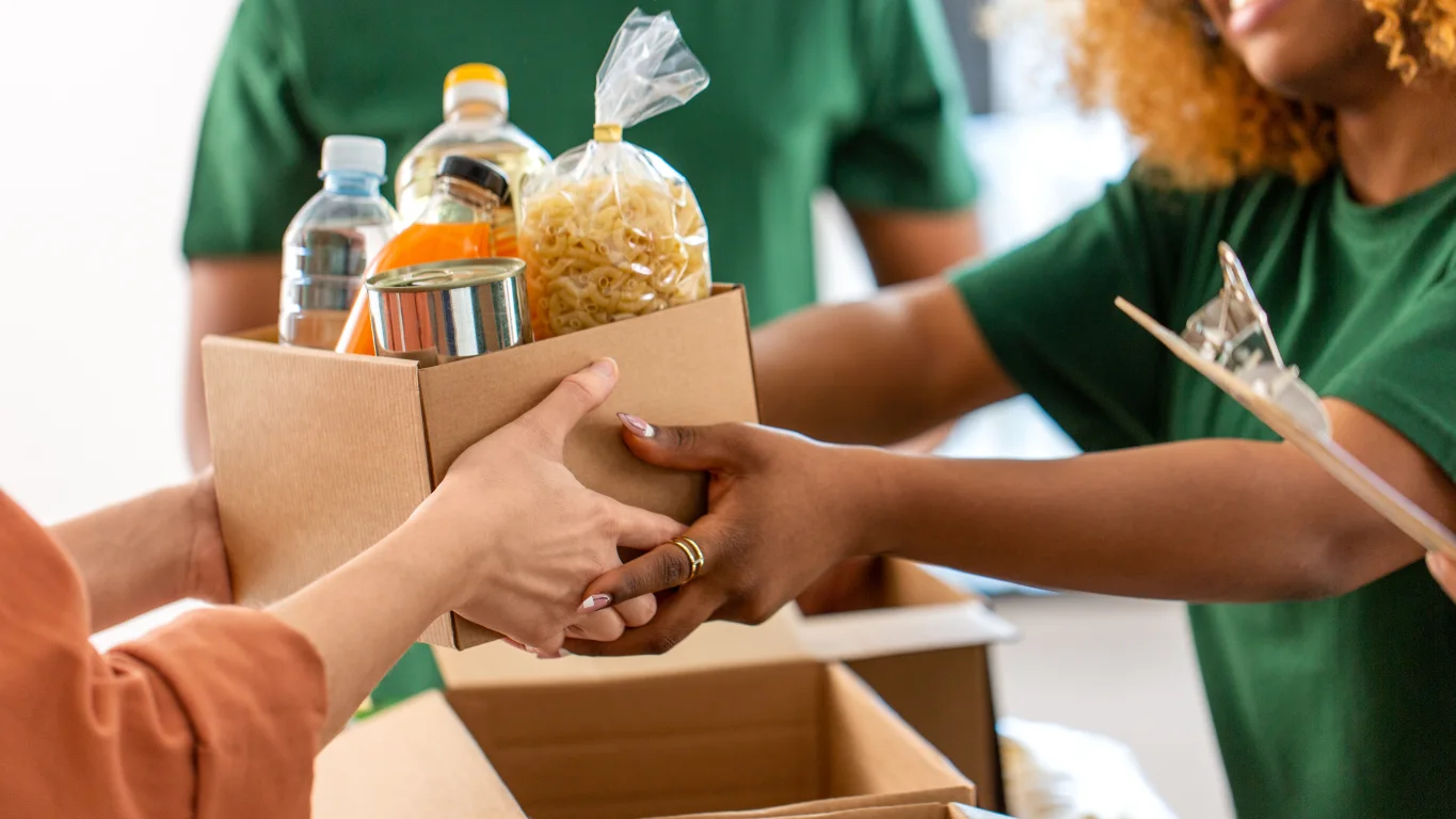 Group of diverse volunteers working together and smiling